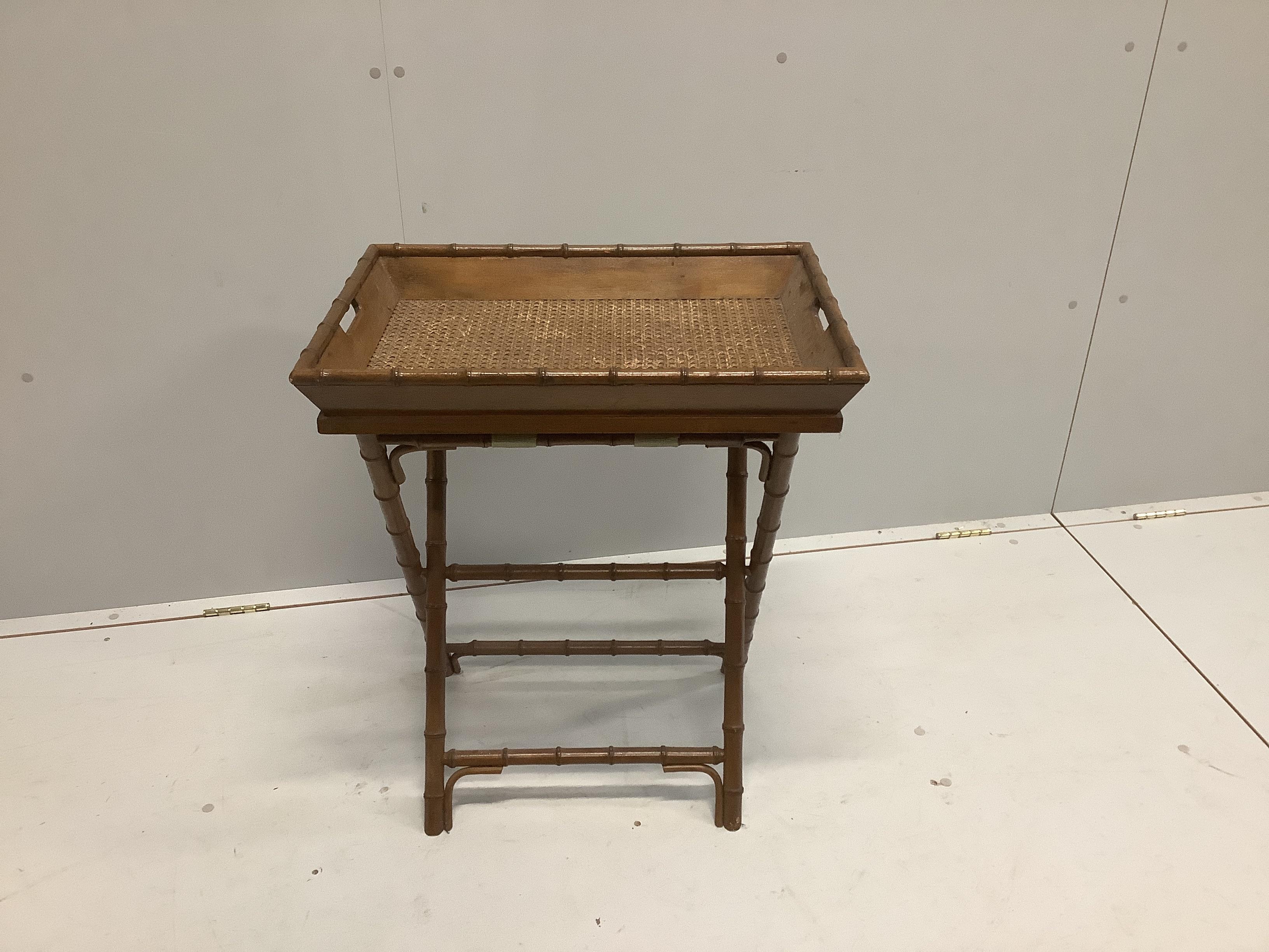 A Regency style caned faux bamboo butler’s tray on folding stand, width 61cm, depth 43cm, height 70cm